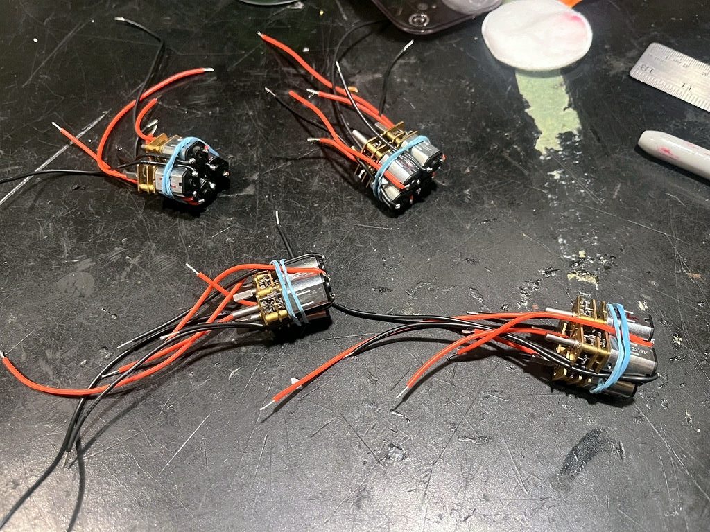 Gear motors with leads soldered on, bundled in pairs